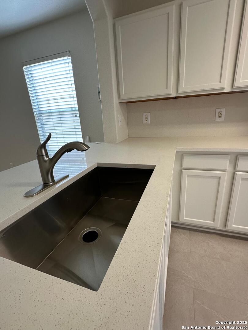 25346 Colt River San Antonio, TX 78261 - Photo 7 of 35 a bathroom with a sink and a mirror