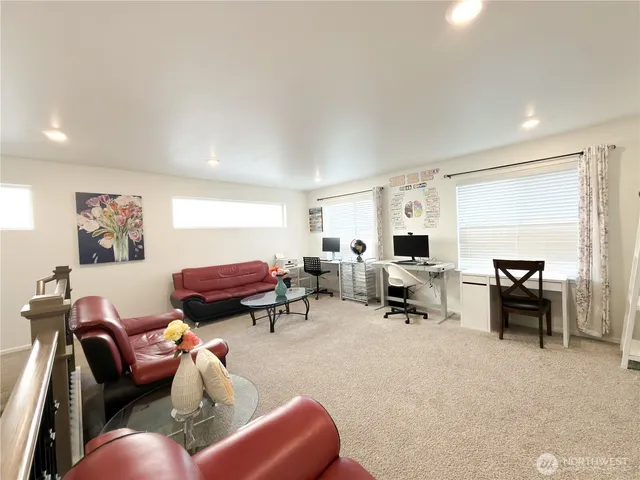 a spacious bedroom with a bed and a cabinets