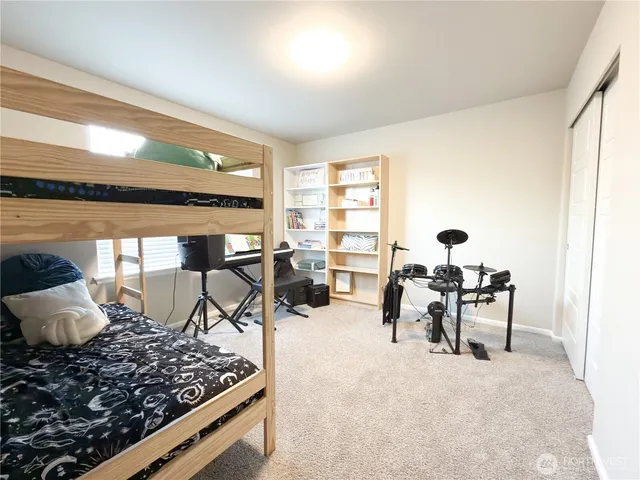 a bedroom with furniture and a window