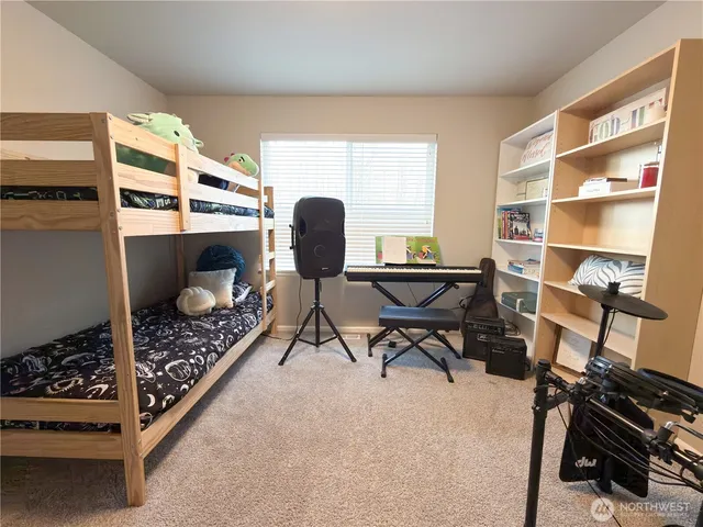 a bedroom with a bed and window