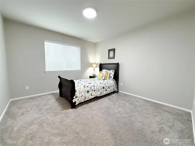 a bathroom with a double vanity sink toilet and shower