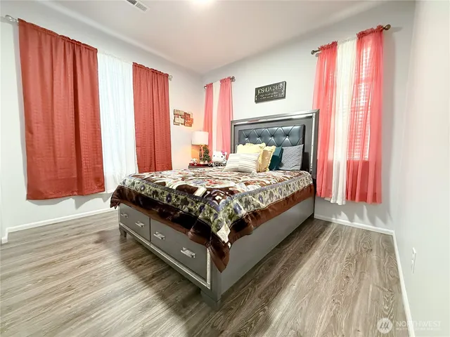 a large kitchen with a table and chairs in it