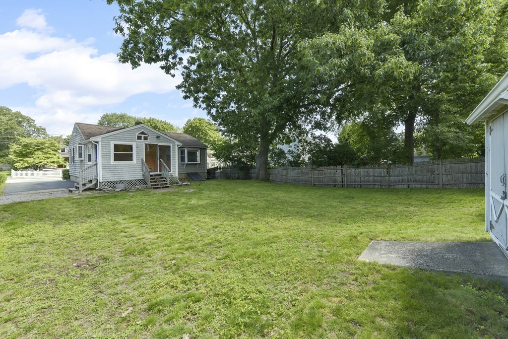 71 Paul Street Dedham, MA 02026 - Photo 3 of 22 a view of a house with a backyard