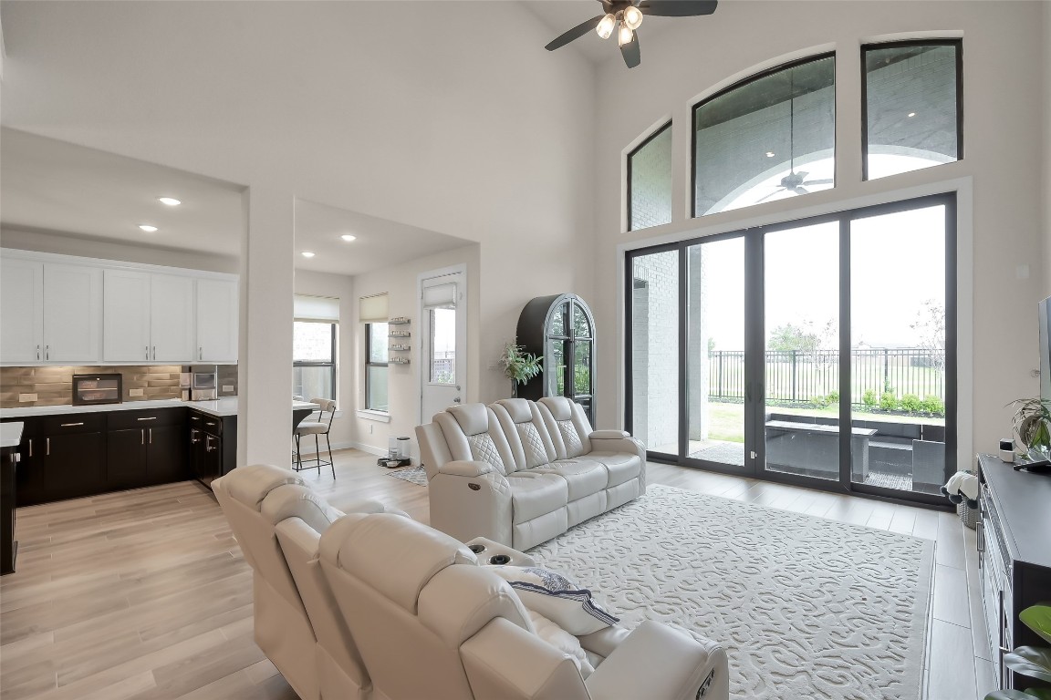 6718 Waxbill Road Katy, TX 77493 - Photo 18 of 48 a living room with furniture fireplace and a large window