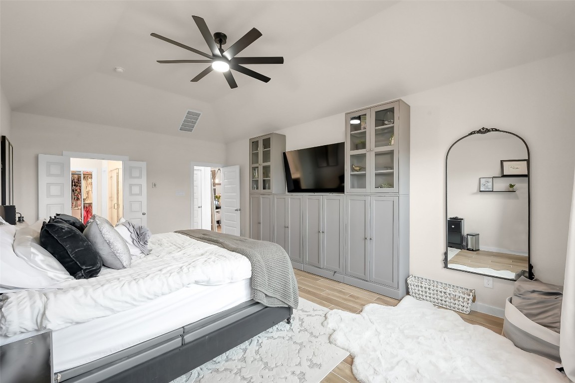 6718 Waxbill Road Katy, TX 77493 - Photo 21 of 48 a bedroom with a bed and a television