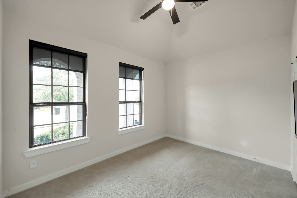 6718 Waxbill Road Katy, TX 77493 - Photo 25 of 48 an empty room with a window