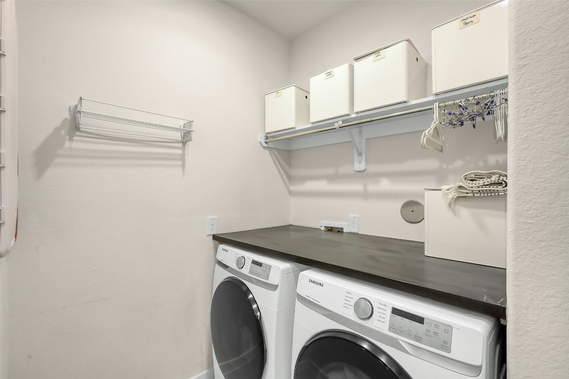 6718 Waxbill Road Katy, TX 77493 - Photo 28 of 48 a utility room with dryer and washer
