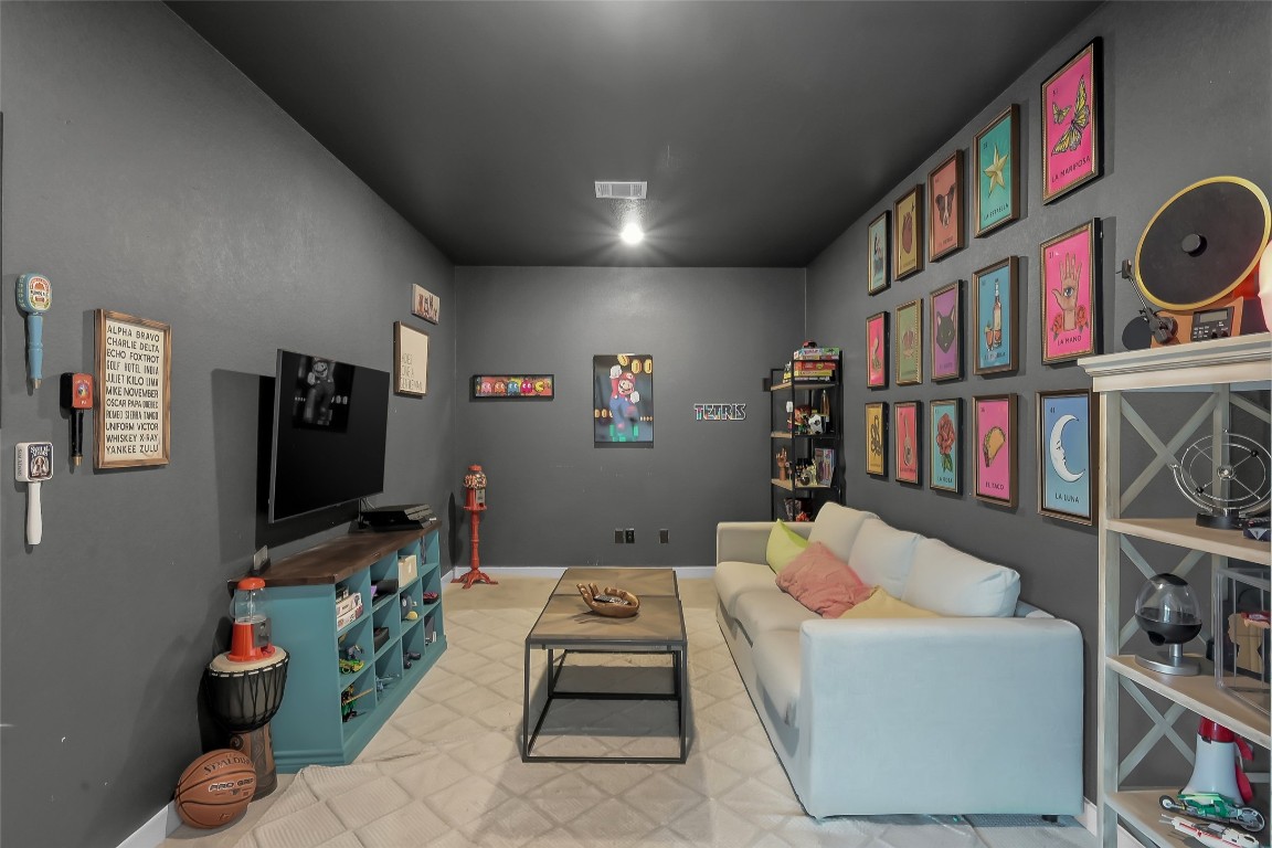 6718 Waxbill Road Katy, TX 77493 - Photo 31 of 48 a living room with furniture toys and a flat screen tv