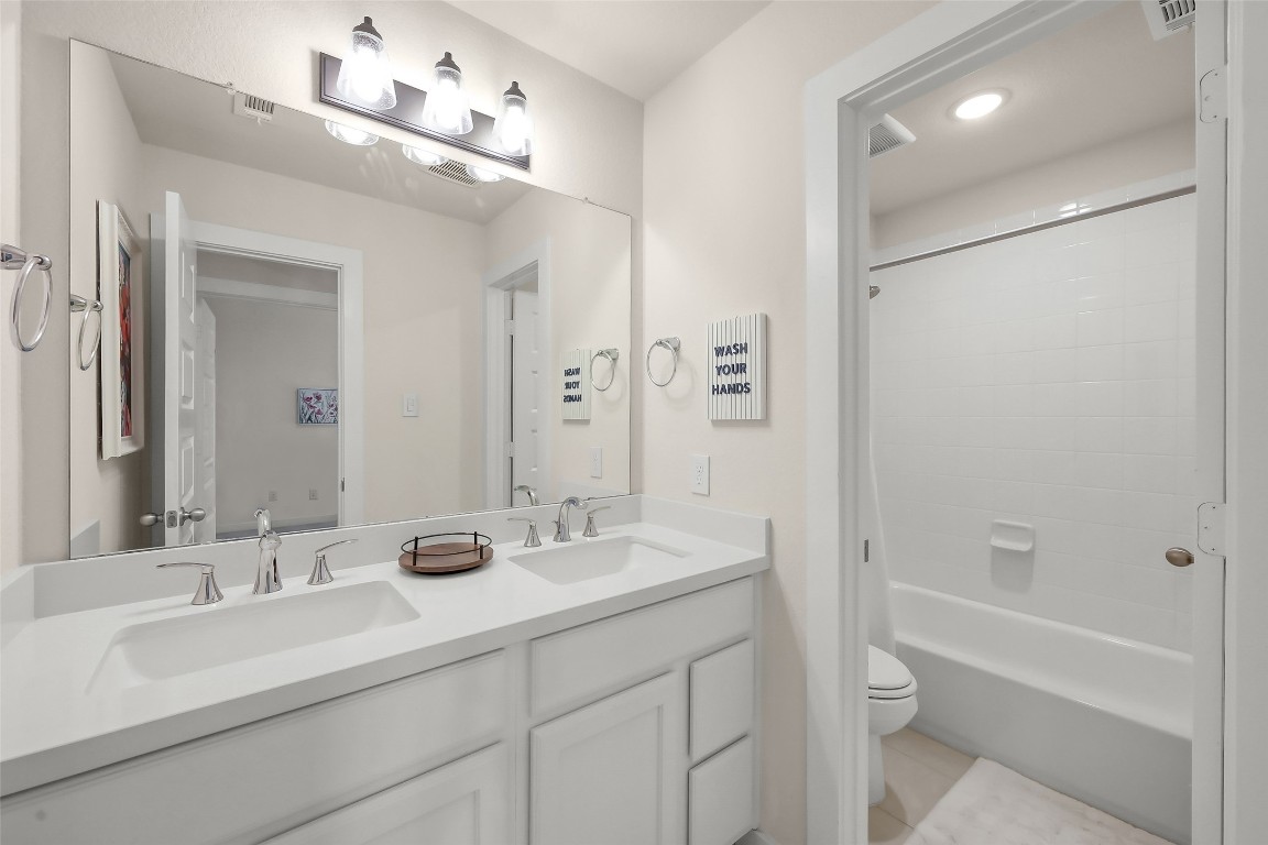 6718 Waxbill Road Katy, TX 77493 - Photo 34 of 48 a bathroom with a sink double vanity granite tub and shower