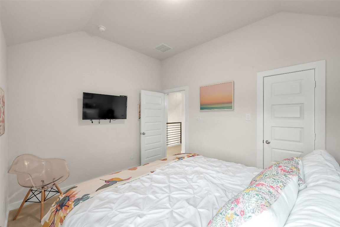 6718 Waxbill Road Katy, TX 77493 - Photo 36 of 48 a bedroom with a bed and a flat screen tv