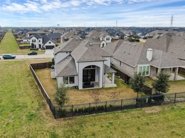 an aerial view of residential houses with outdoor space
