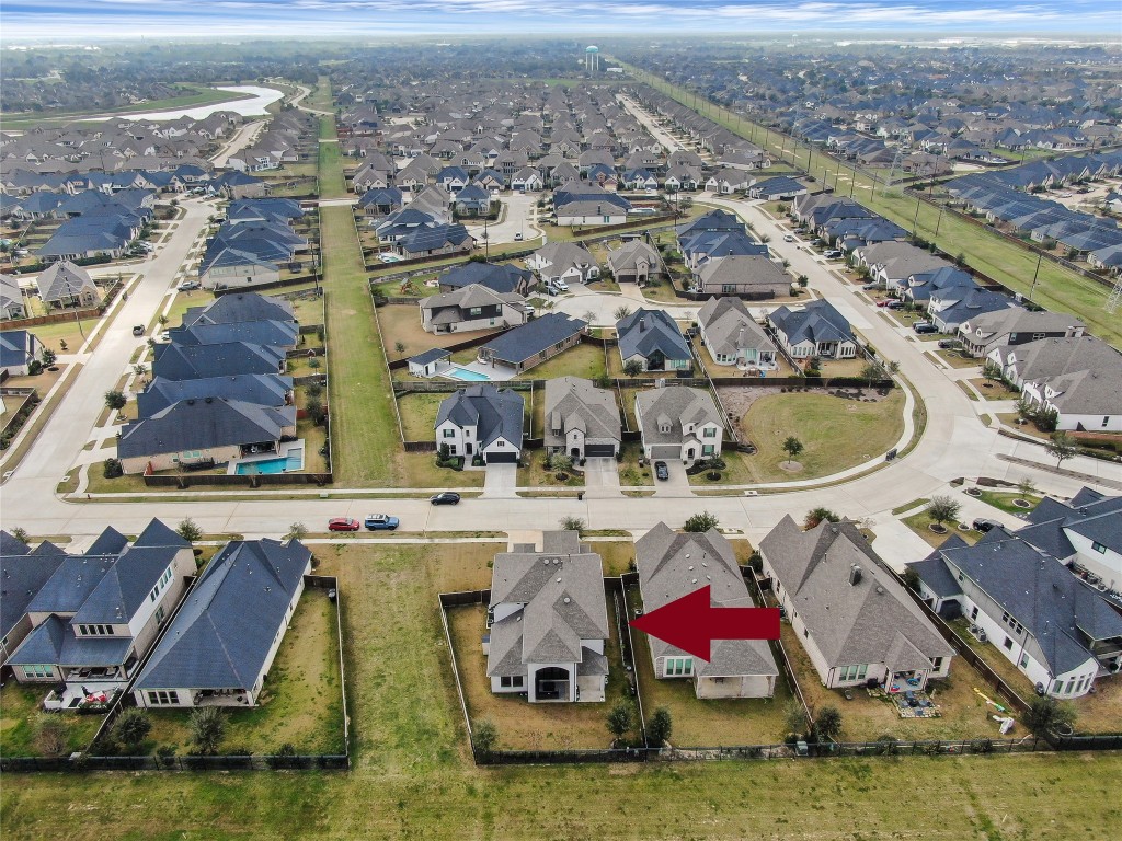 6718 Waxbill Road Katy, TX 77493 - Photo 45 of 48 an aerial view of residential houses with outdoor space and swimming pool