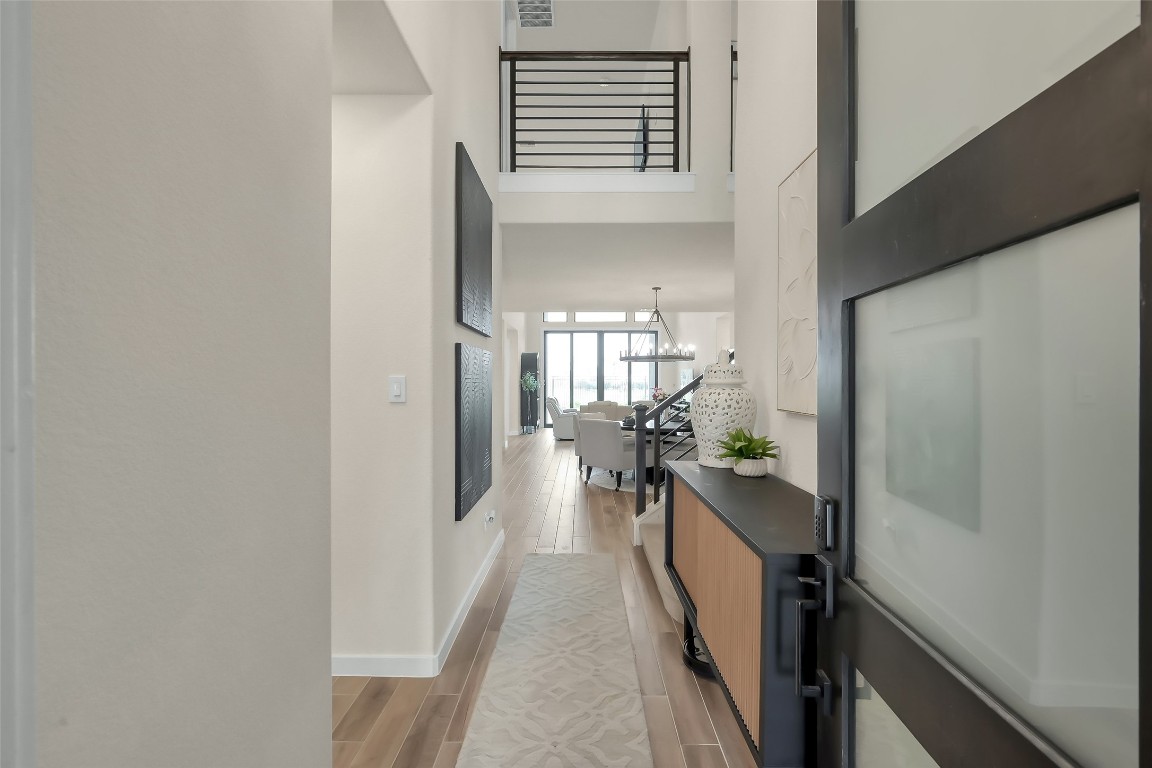 6718 Waxbill Road Katy, TX 77493 - Photo 6 of 48 a view of a hallway with a couch