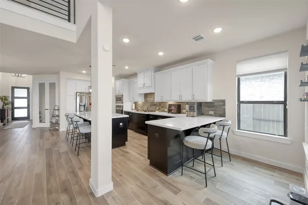 a open kitchen with a table and chairs in it