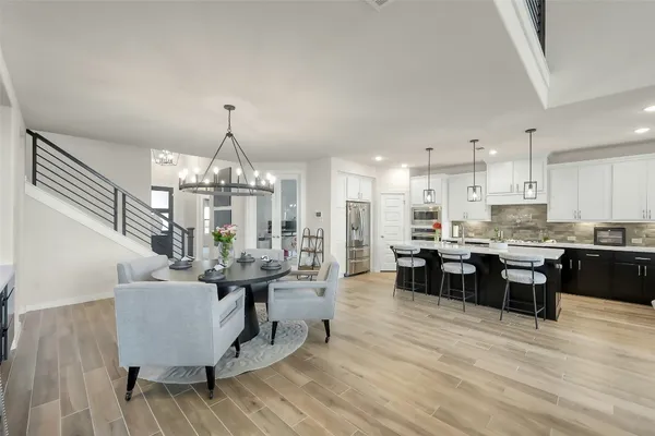 a living room with furniture and kitchen view