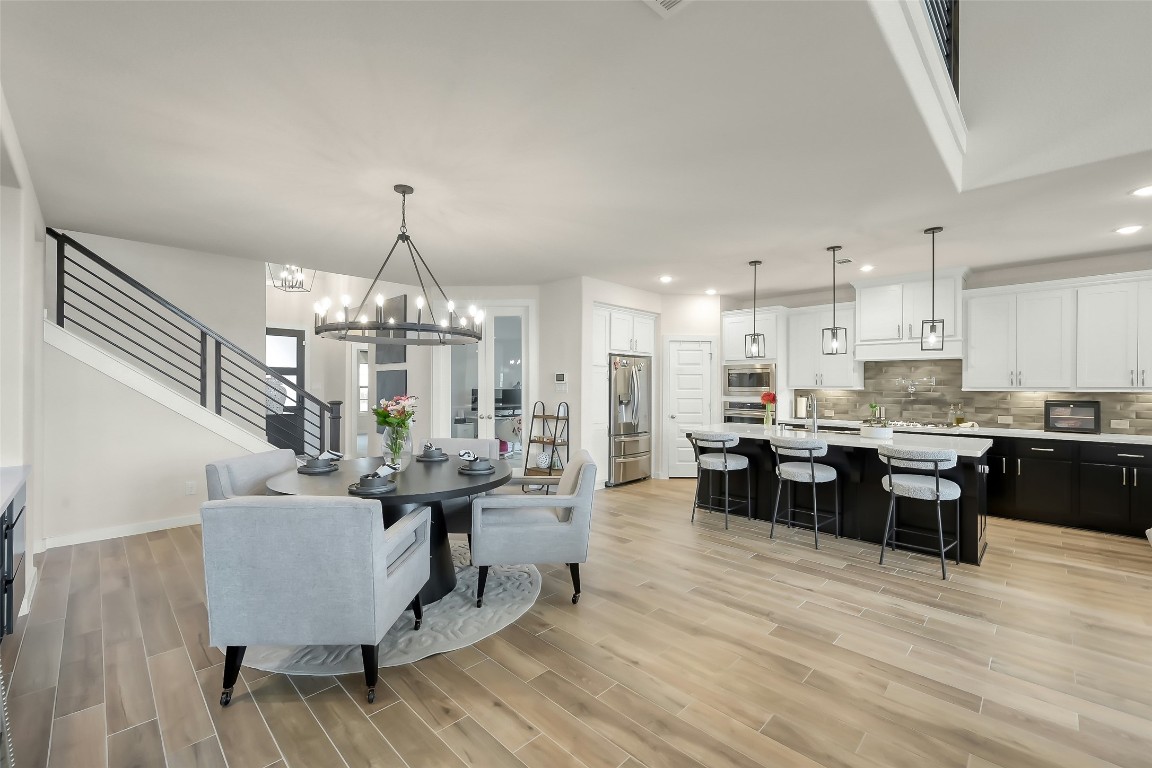 6718 Waxbill Road Katy, TX 77493 - Photo 8 of 48 a living room with furniture and kitchen view