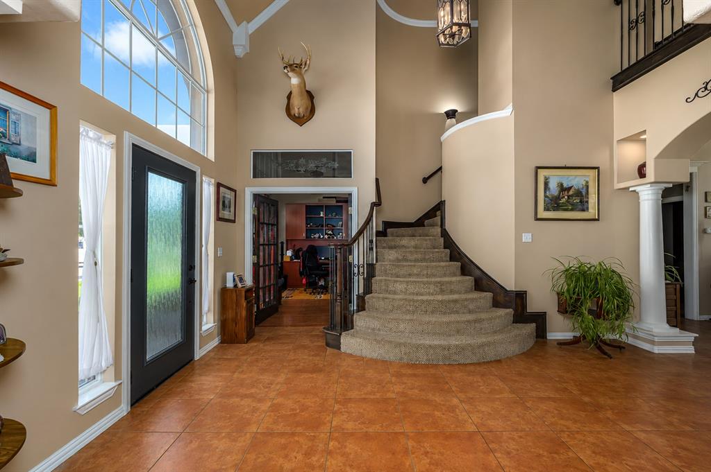 100 Manders Court Runaway Bay, TX 76426 - Photo 5 of 33 a view of a hallway with paintings on the wall