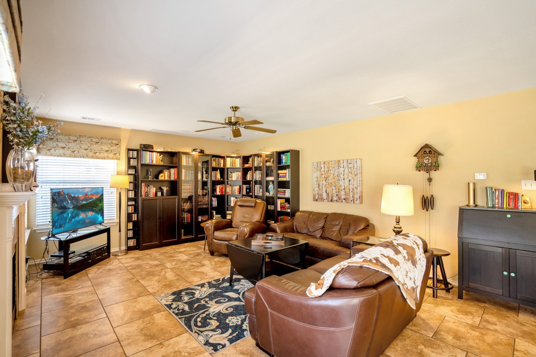 412 Derby Lane Georgetown, TX 78626 - Photo 11 of 37 a living room with furniture and a flat screen tv