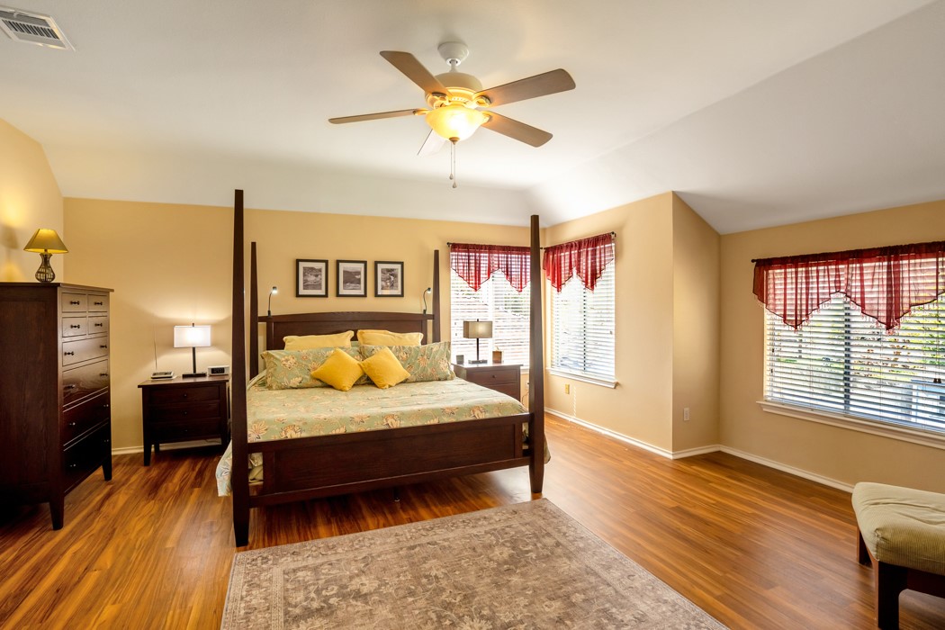 412 Derby Lane Georgetown, TX 78626 - Photo 18 of 37 a bedroom with a bed and wooden floor