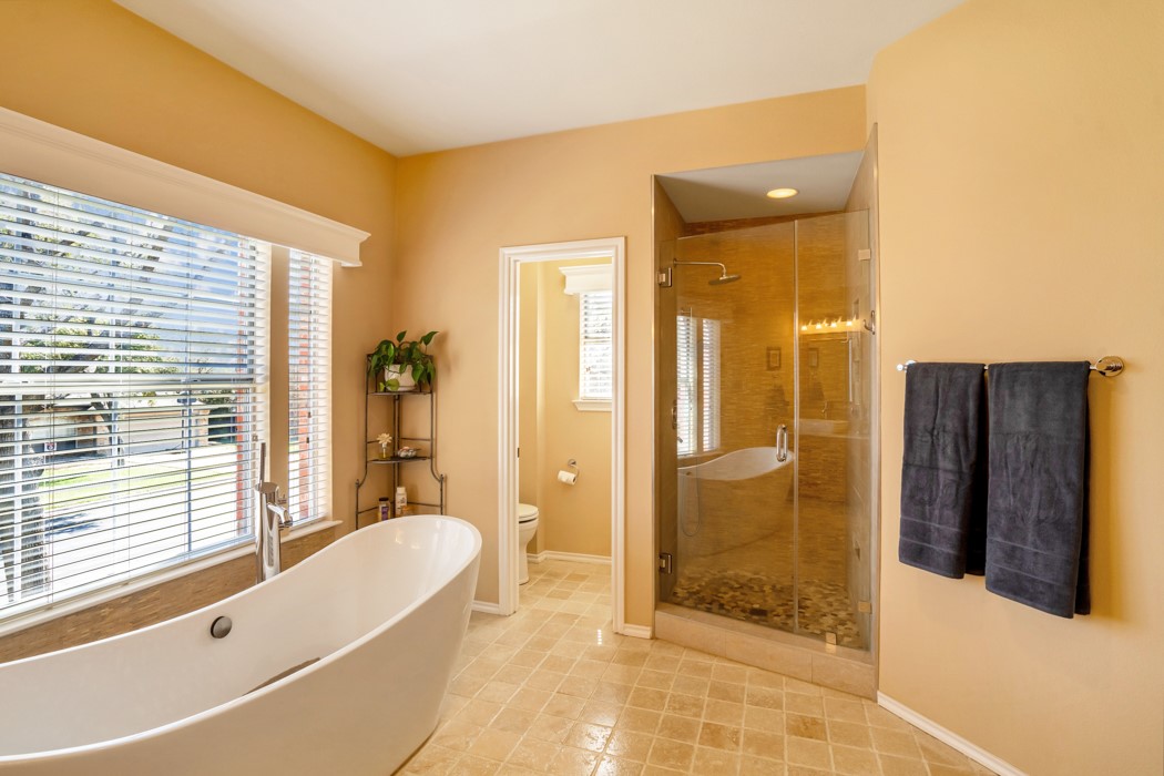 412 Derby Lane Georgetown, TX 78626 - Photo 21 of 37 a bathroom with a tub shower and sink