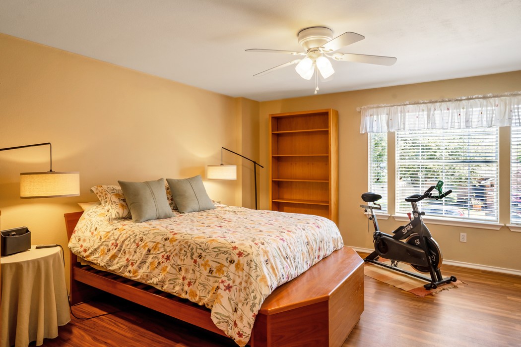 412 Derby Lane Georgetown, TX 78626 - Photo 23 of 37 a bedroom with a bed and a chandelier