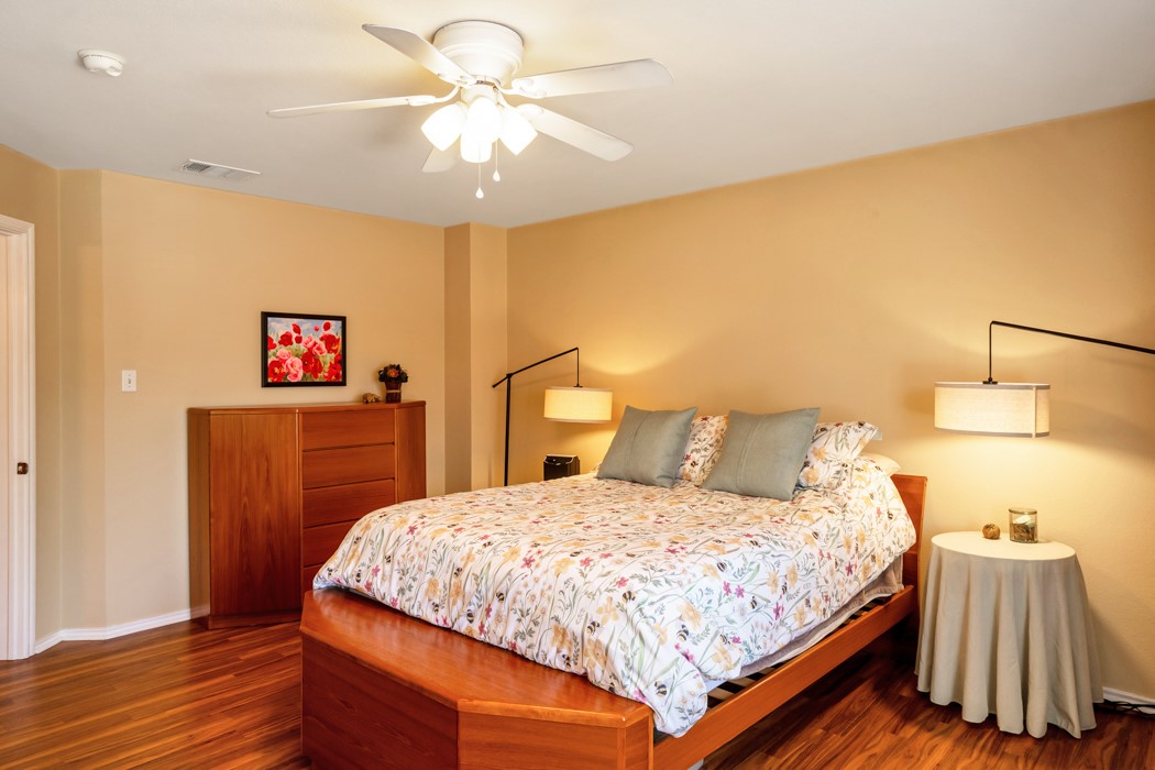412 Derby Lane Georgetown, TX 78626 - Photo 24 of 37 a bedroom with a bed and wooden floor