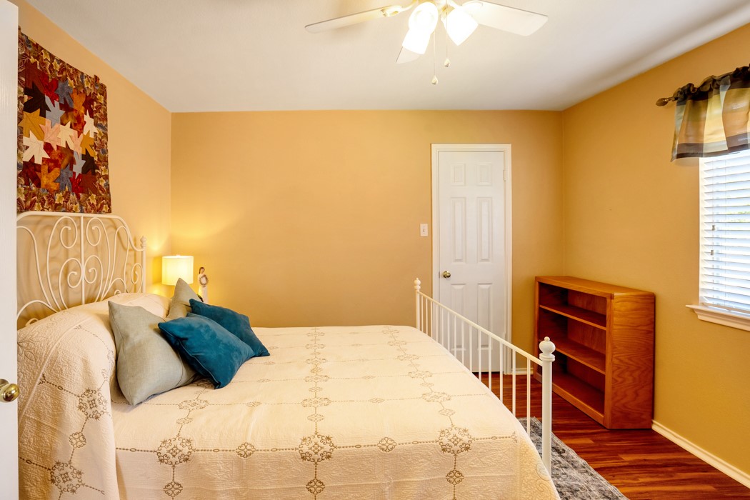 412 Derby Lane Georgetown, TX 78626 - Photo 25 of 37 a bedroom with a bed and a flat screen tv