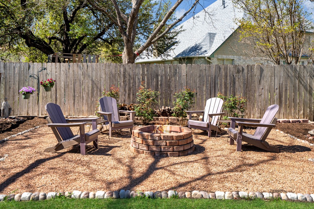 412 Derby Lane Georgetown, TX 78626 - Photo 30 of 37 a view of a dinning tables and chairs in backyard of the house