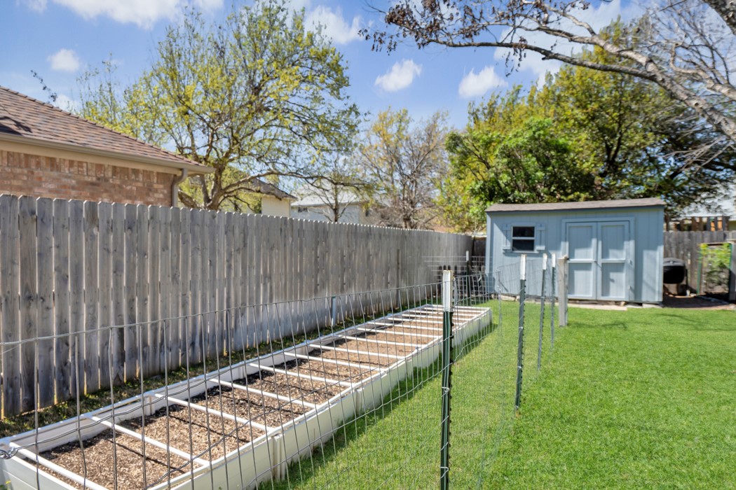 412 Derby Lane Georgetown, TX 78626 - Photo 31 of 37 a view of a backyard with a wooden fence