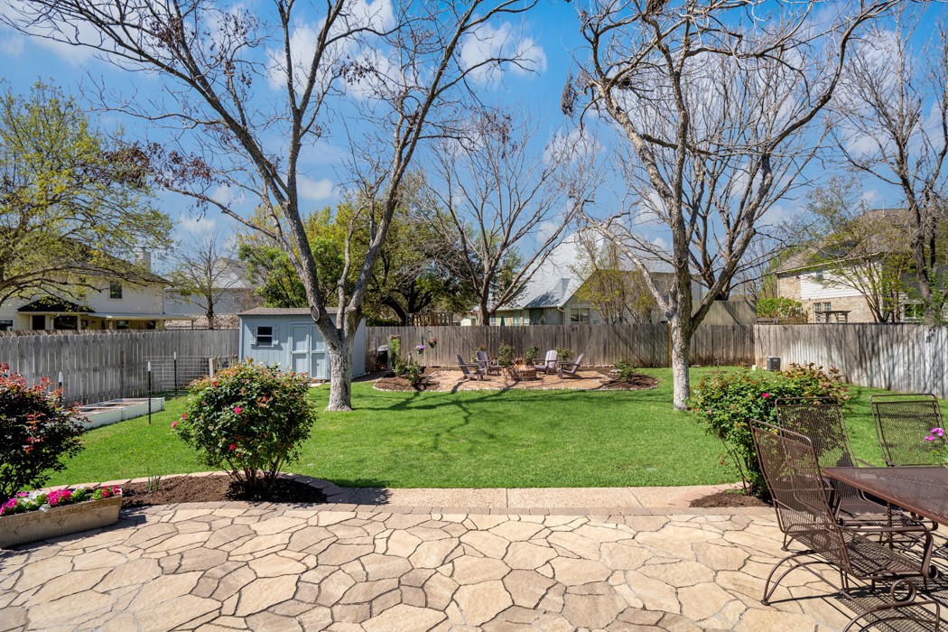 412 Derby Lane Georgetown, TX 78626 - Photo 34 of 37 a view of a garden with a bench