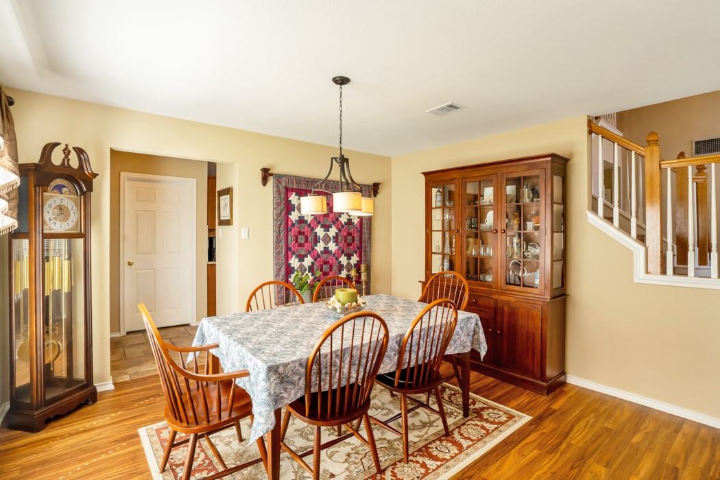 412 Derby Lane Georgetown, TX 78626 - Photo 8 of 37 a dining room with furniture a chandelier and wooden floor