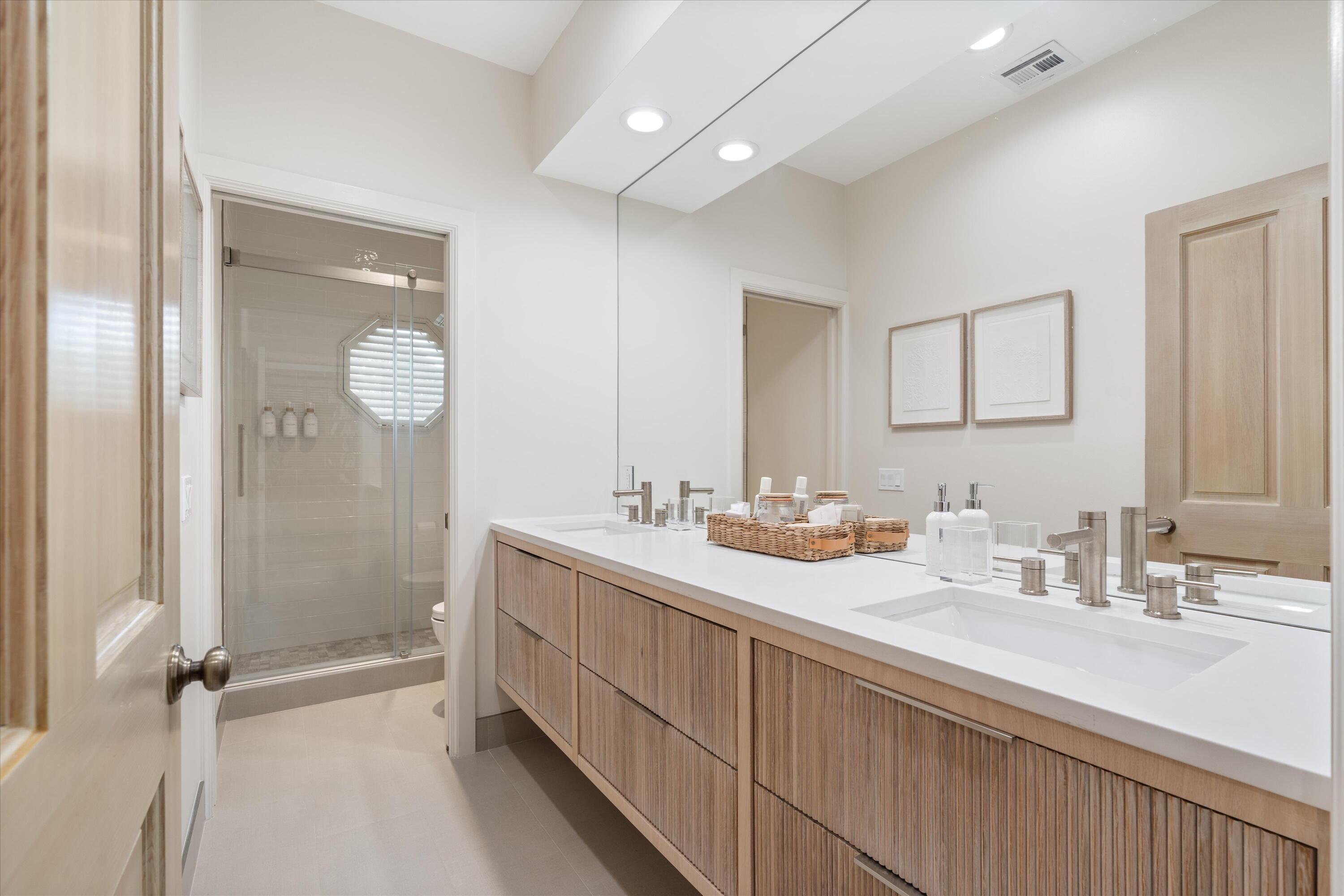 121 Turnberry Drive Atlantis, FL 33462 - Photo 27 of 47 a bathroom with a double vanity sink mirror and shower