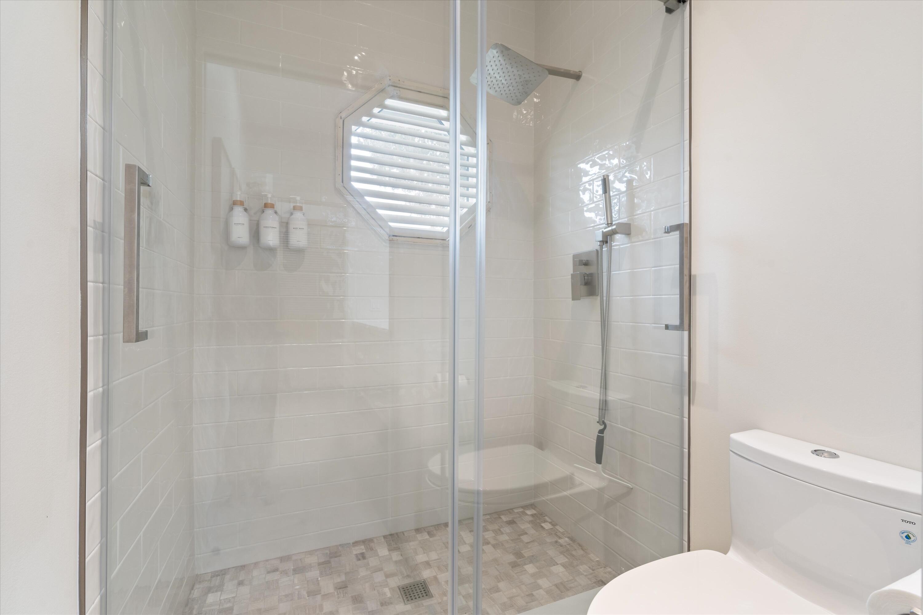 121 Turnberry Drive Atlantis, FL 33462 - Photo 28 of 47 a bathroom with a shower and toilet