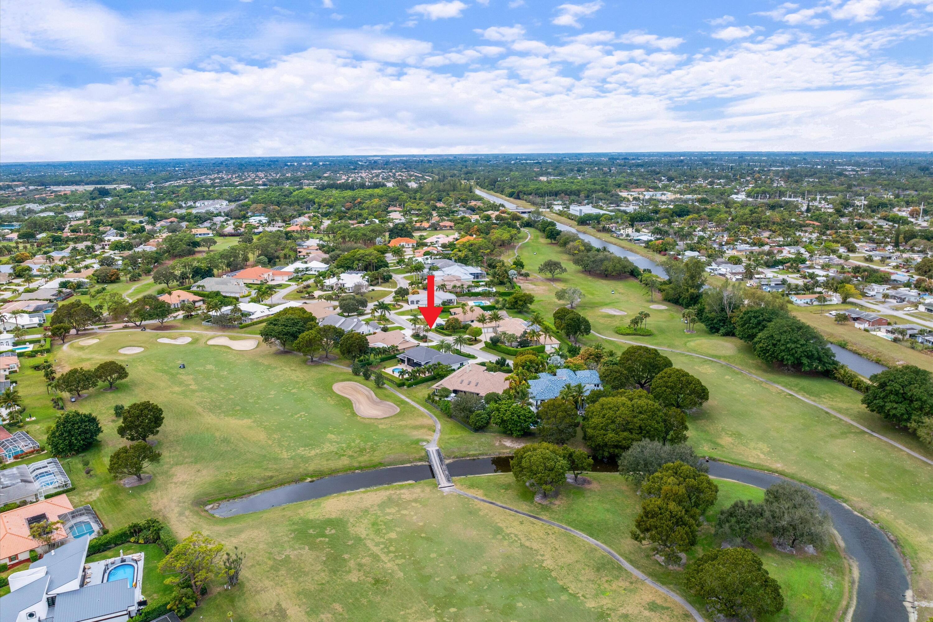 121 Turnberry Drive Atlantis, FL 33462 - Photo 4 of 47 an aerial view of residential houses with outdoor space