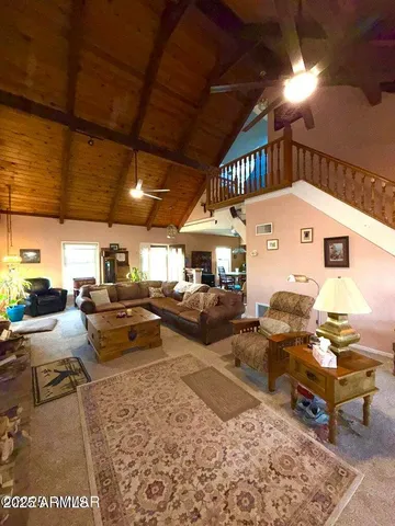a view of a patio with table and chairs