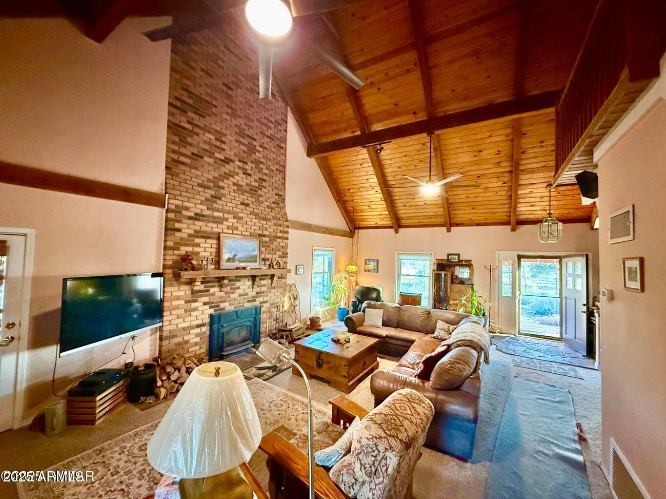 280 County Road Concho, AZ 85924 - Photo 12 of 46 a living room with furniture a rug and a large window