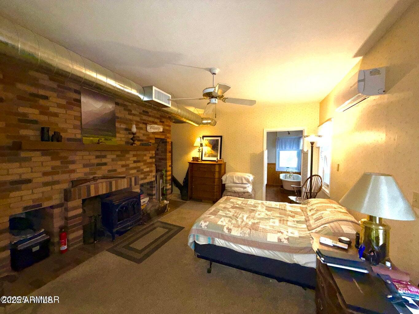 280 County Road Snowflake, AZ 85937 - Photo 18 of 45 a bedroom with a bed and walk in closet