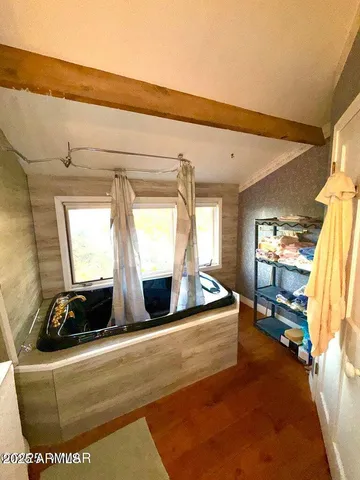 a bathroom with a sink a toilet and a tub