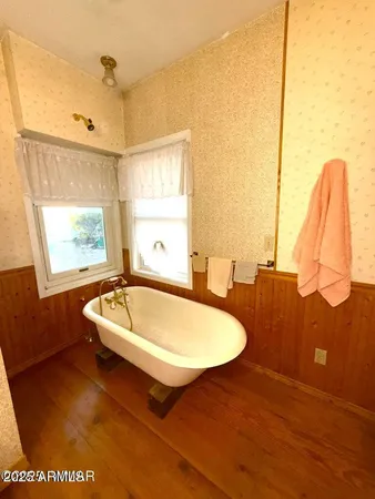 a bathroom with a sink a toilet and a tub