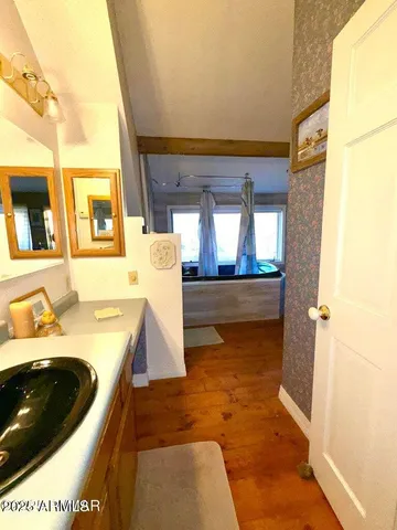 a bedroom with furniture and a bed