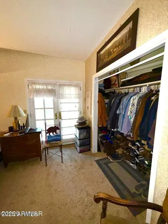 a bedroom with furniture and a bed