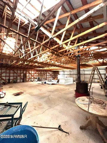 a view of empty room with a ceiling fan and window