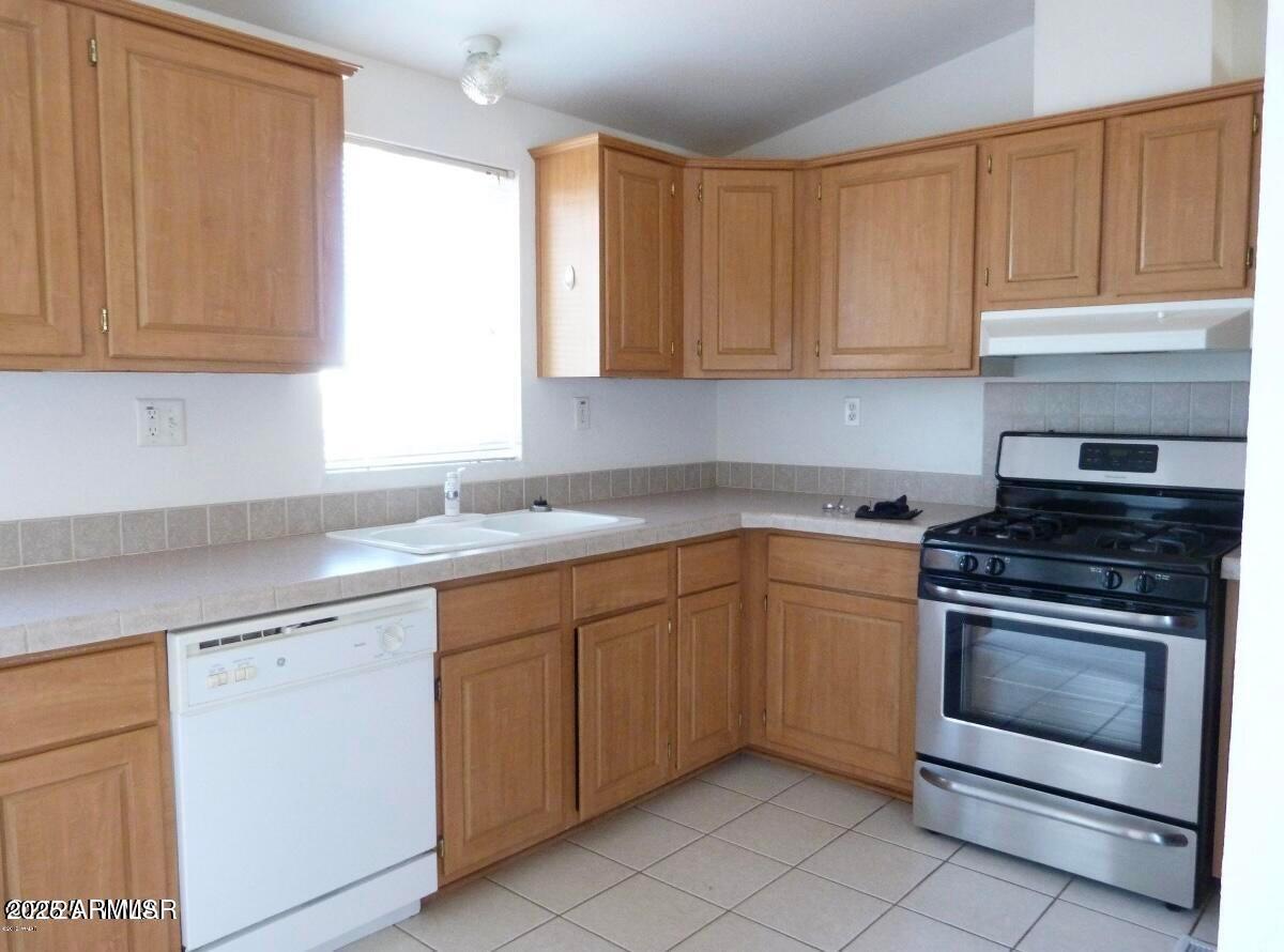 280 County Road Snowflake, AZ 85937 - Photo 39 of 45 a kitchen with granite countertop white cabinets and stainless steel appliances