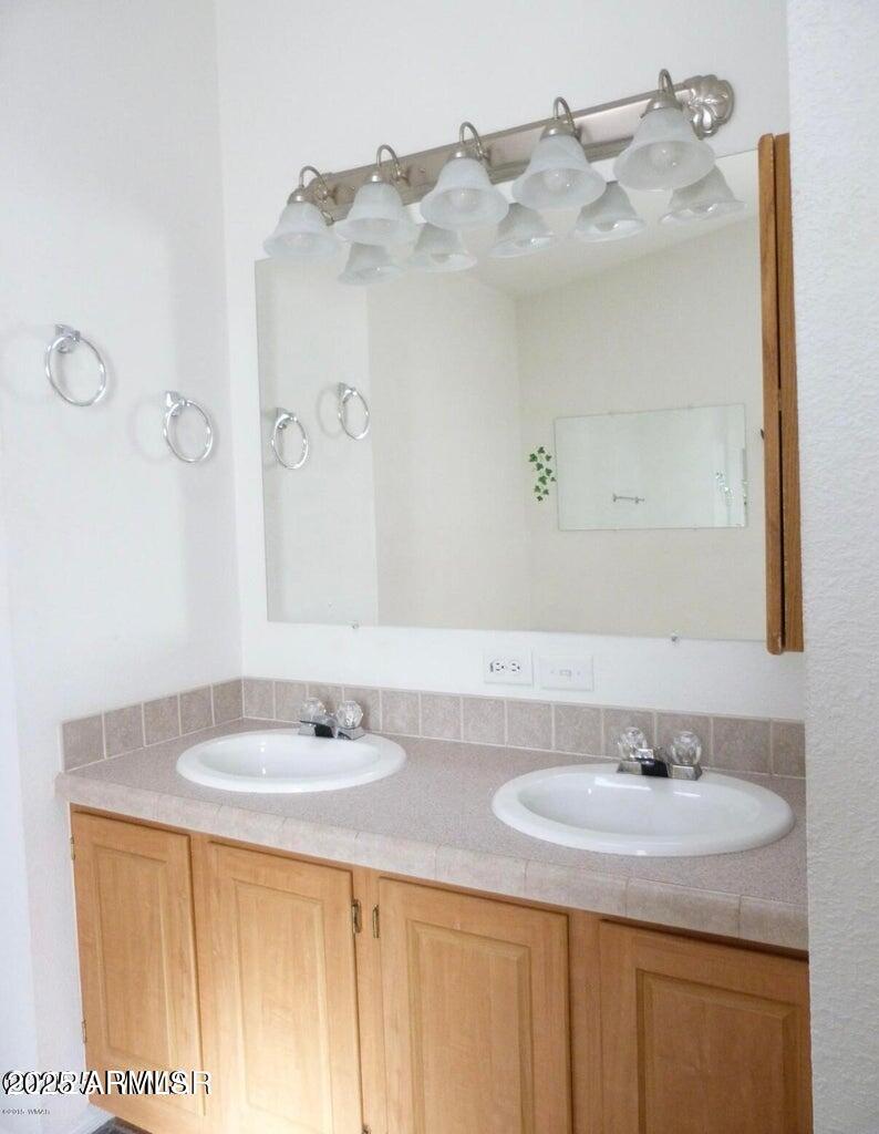 280 County Road Snowflake, AZ 85937 - Photo 43 of 45 a bathroom with a sink and a mirror
