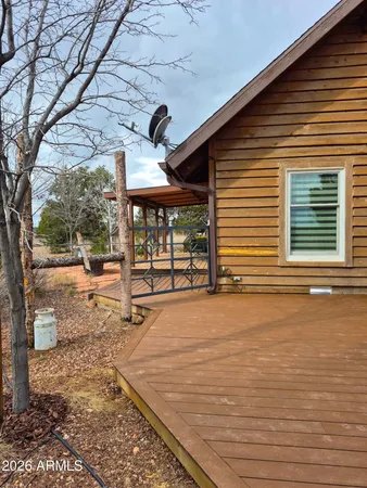 a living room with furniture a rug and a large window