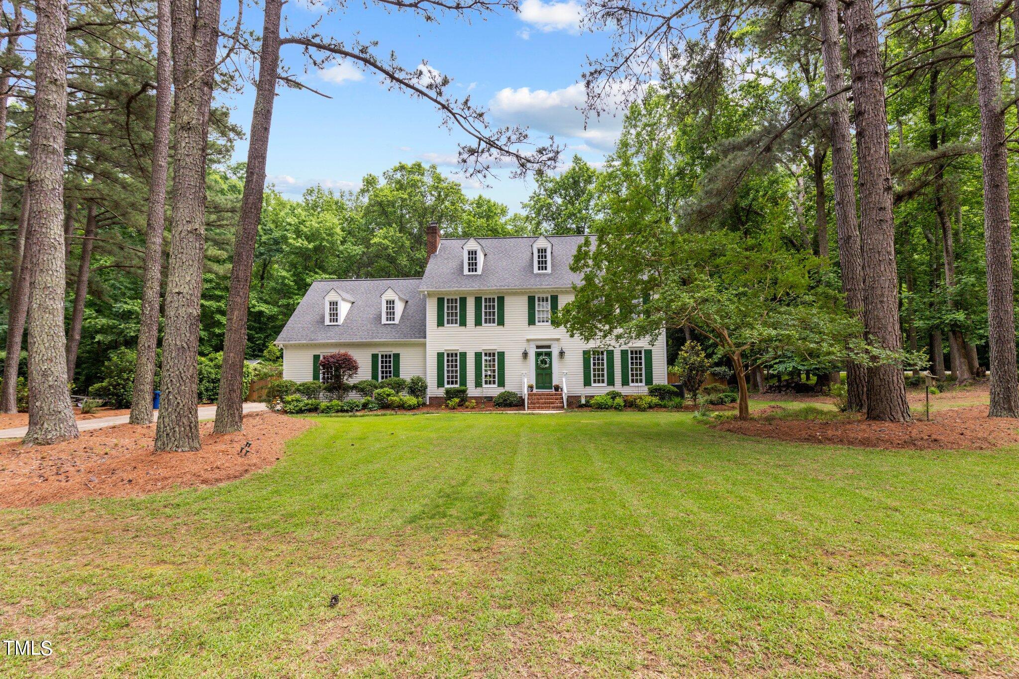 300 Key Court Raleigh, NC 27614 - Photo 2 of 85 a view of a house with a big yard and large trees