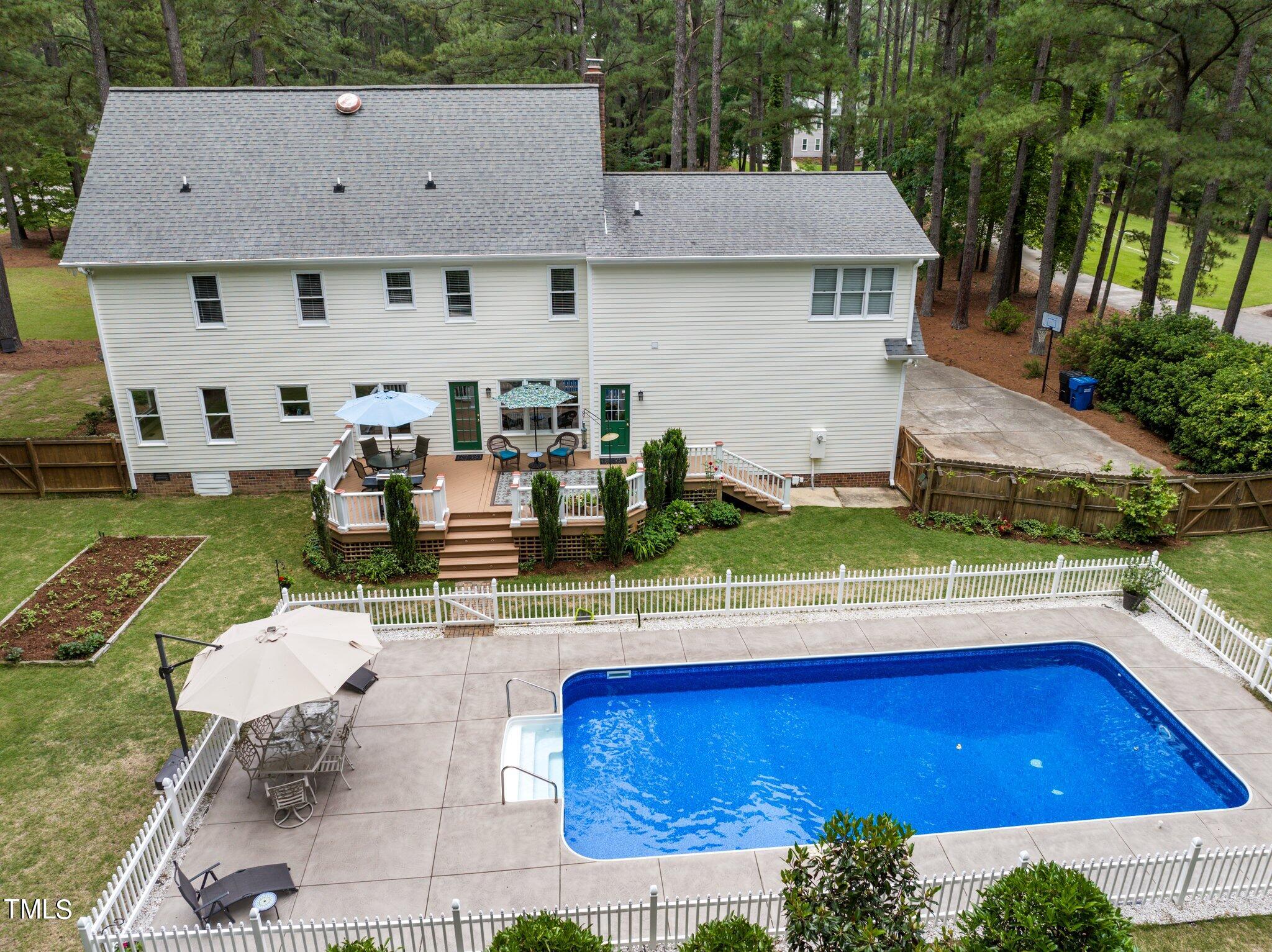 300 Key Court Raleigh, NC 27614 - Photo 47 of 85 an aerial view of a house with swimming pool and patio