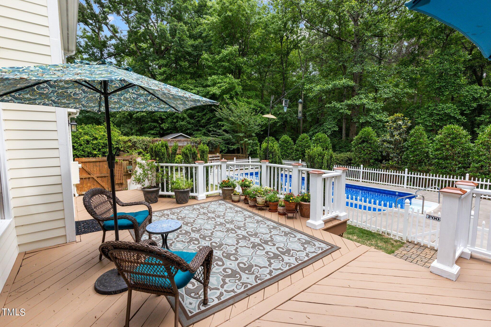 300 Key Court Raleigh, NC 27614 - Photo 50 of 85 a view of a wooden chairs and table in the patio