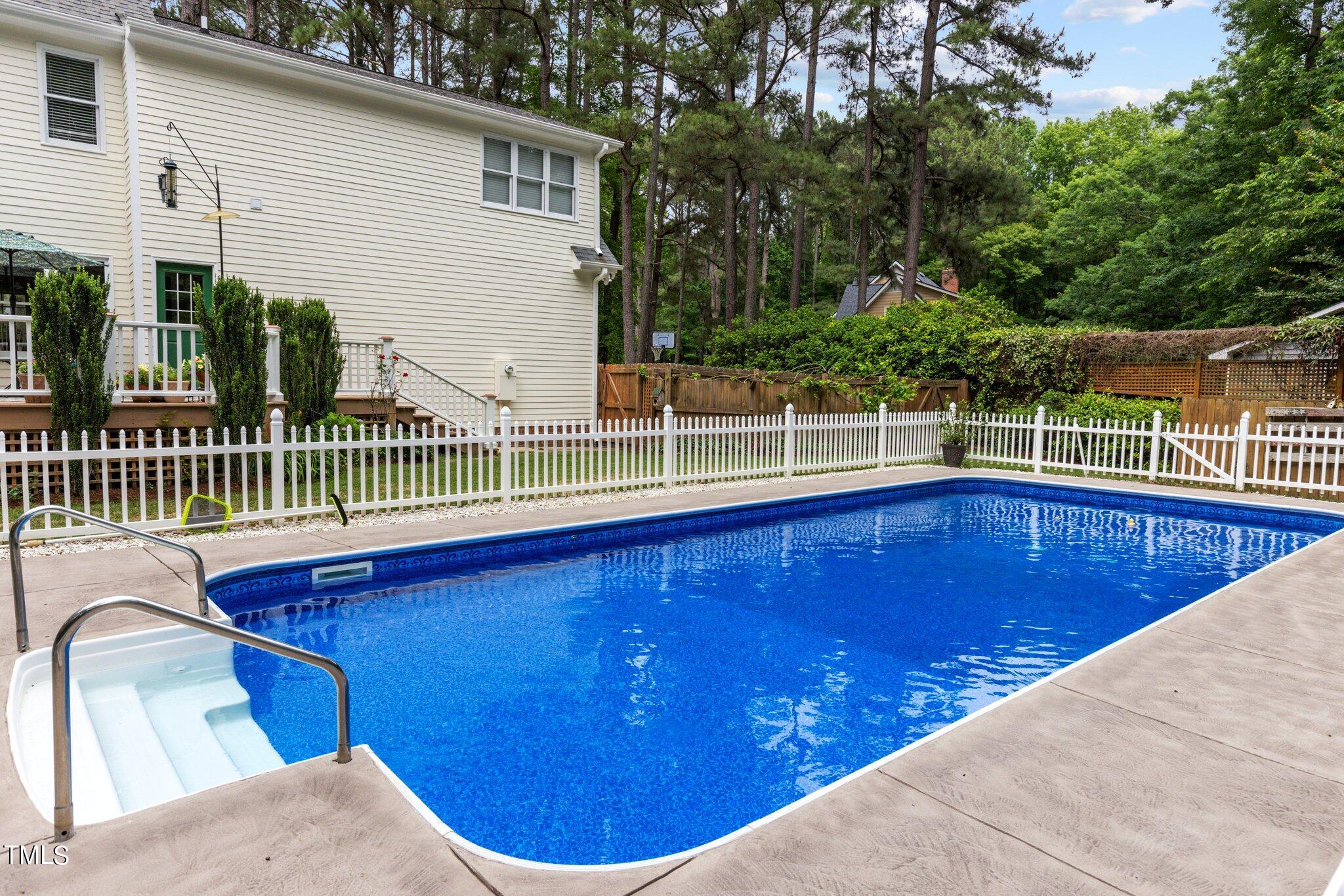 300 Key Court Raleigh, NC 27614 - Photo 59 of 85 a view of a swimming pool with a deck
