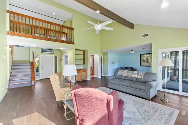a living room with furniture flat screen tv and a fireplace
